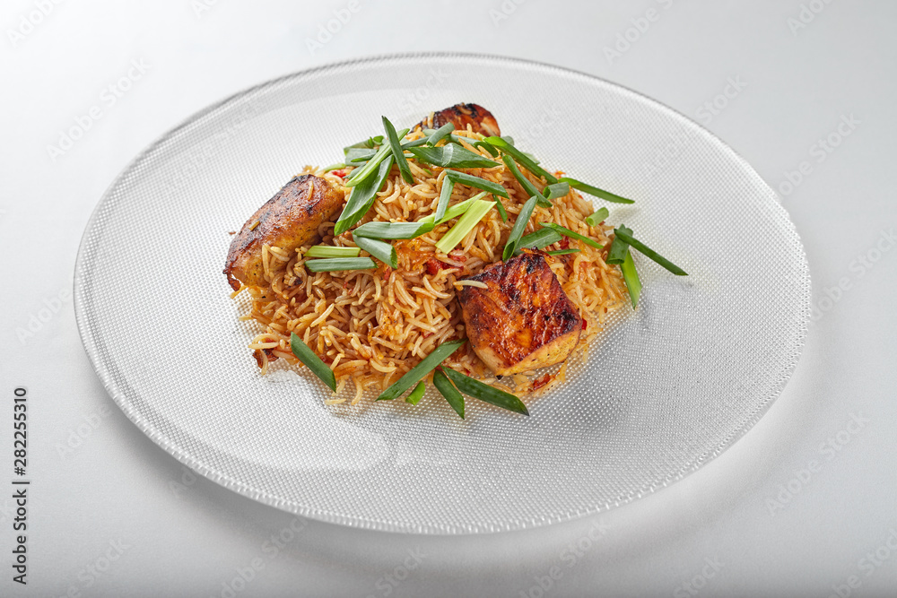 Pilaf with salmon on a white plate Pilaf with salmon on a white plate