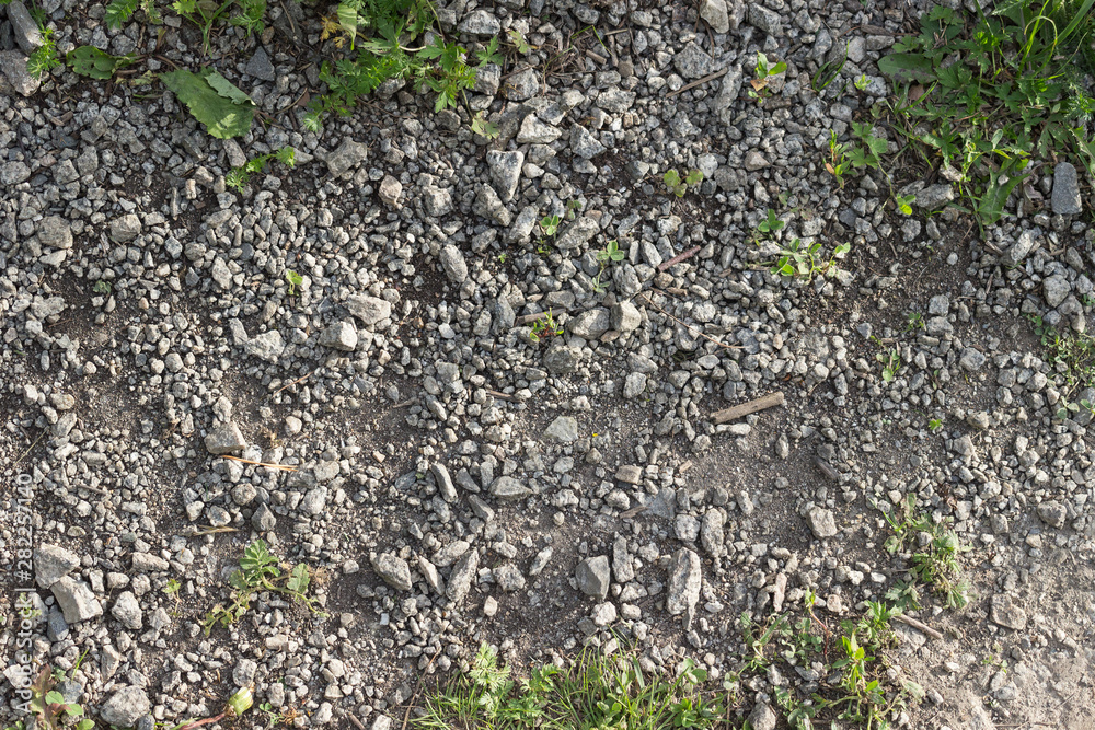 Natural texture with stones, earth and grass Natural texture with stones, earth and grass