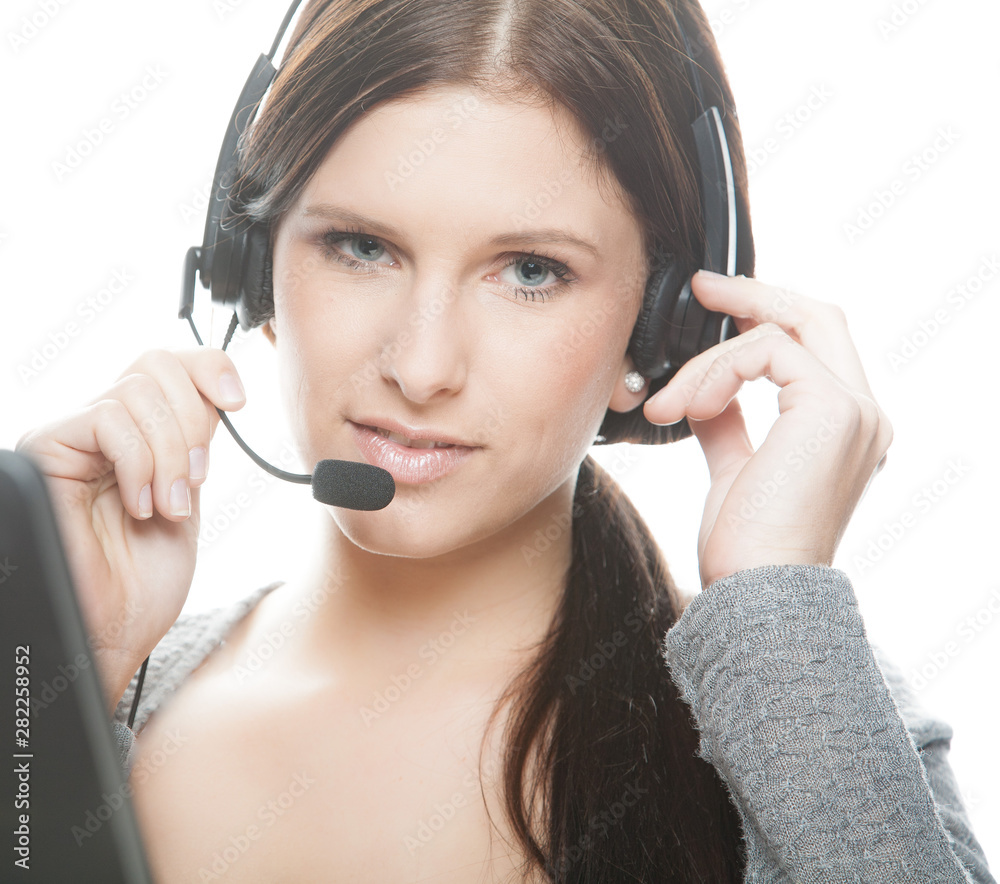 portrait of friendly female call center agent with headset portrait of friendly female call center agent with headset