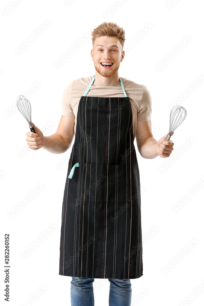 Handsome male chef with whisks on white background Handsome male chef with whisks on white background