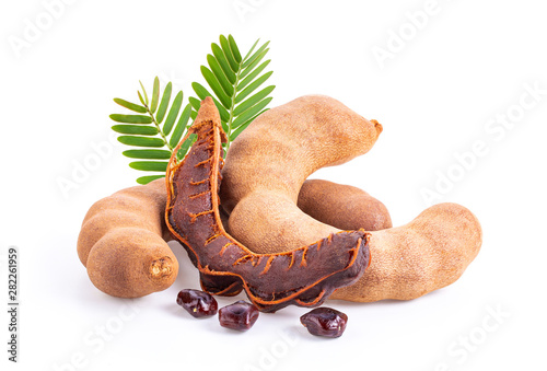 fresh tamarind fruits and leaves isolated on white. full depth of field