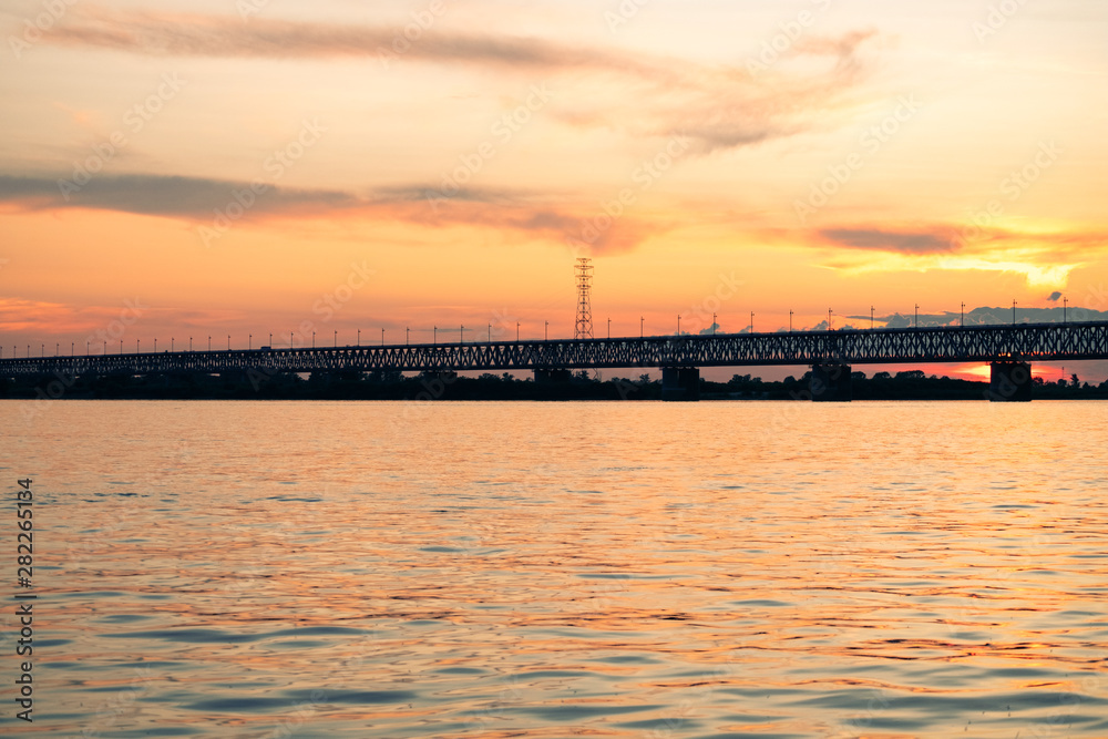 Bridge over the Amur river at sunset. Russia. Khabarovsk. Photo from the middle of the river.