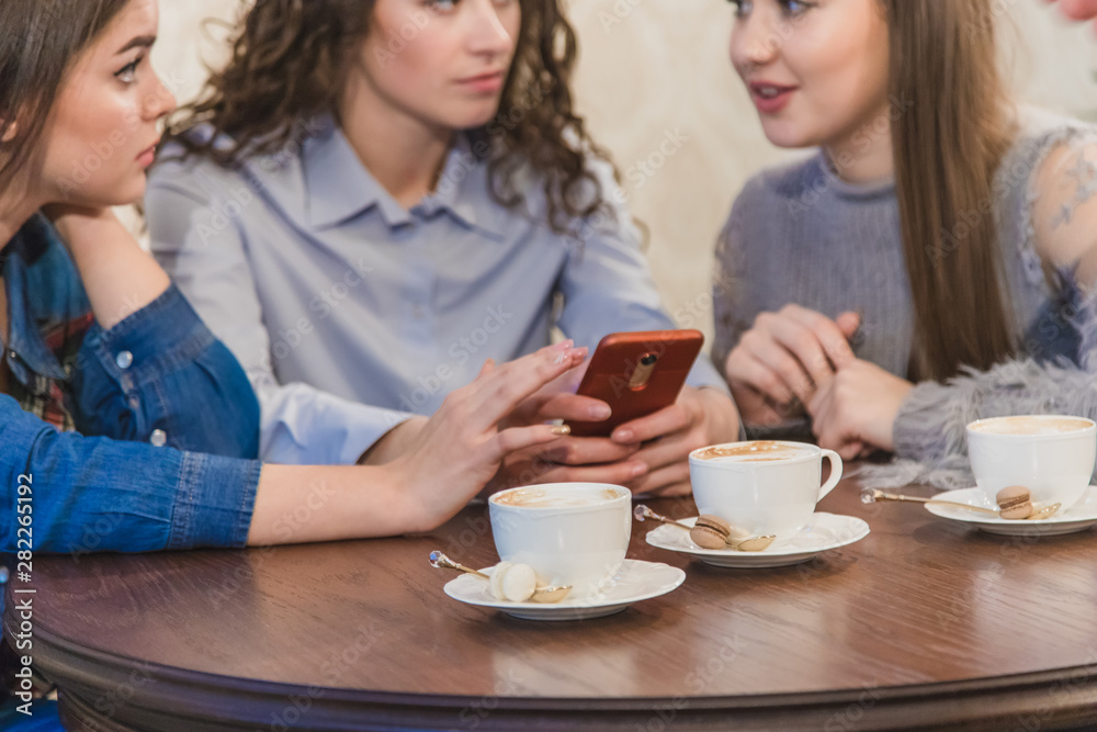 The three best friends came to drink coffee and gossip. Girls are fun and laugh. Girls with beautiful black hair. The three best friends came to drink coffee and gossip. Girls are fun and laugh. Girls with beautiful black hair.