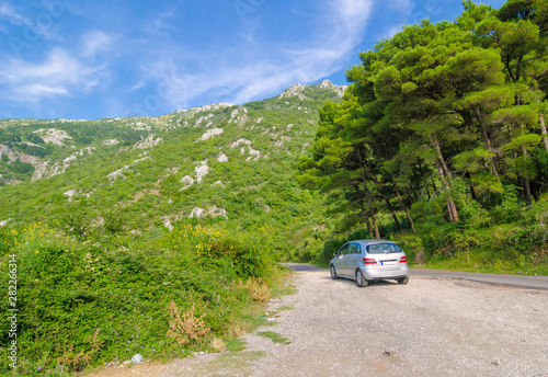 Kotor Serpentine, Mountains of Montenegro - 08.11.2014: Tourist travels by car along dangerous mountain roads of Montenegro