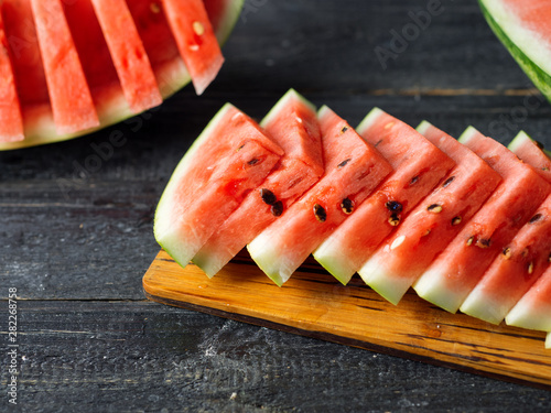 Sliced delicious ripe watermelon on the table close-up