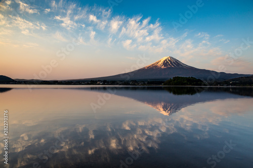Reflections of Mount Fuji in Kawaguchiko Lake at sunrise
