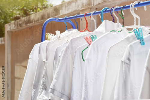 Drying the white shirt in the sun Resulting in damaged fabrics .