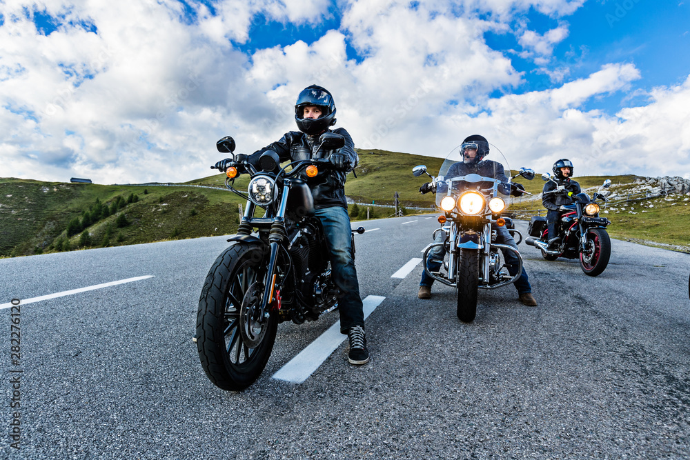 Fototapeta Motorcycle drivers riding in Alpine highway, Nockalmstrasse, Austria, Europe.
