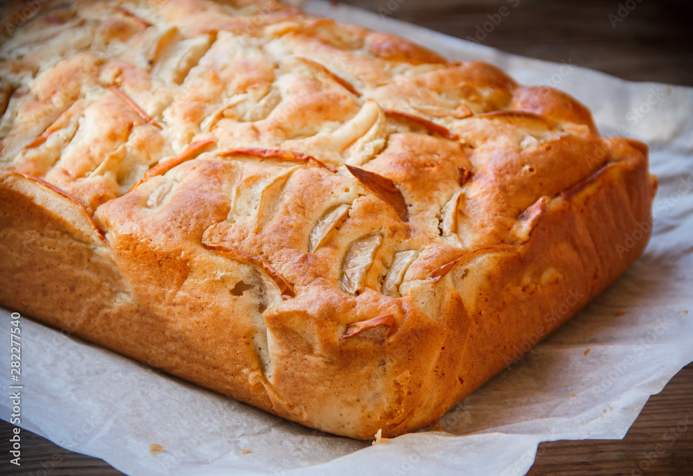 Fresh cakes. Apple pie on a wooden table. Country style.. Fresh cakes. Apple pie on a wooden table. Country style..