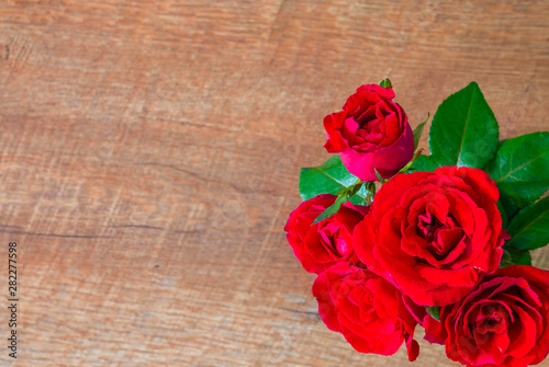 Flat lay of Beautiful rose red on wooden top view background. with copy empty space.