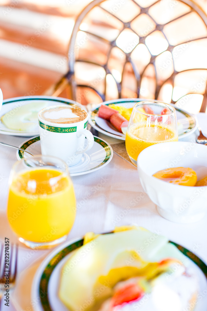 Healthy breakfast with fresh juice and sweet croissant in restaraunt resort outdoor Healthy breakfast with fresh juice and sweet croissant in restaraunt resort outdoor