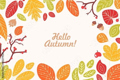 Background or backdrop with frame or border made of fallen dried leaves, acorns, cones, berries and Hello Autumn phrase written with cursive calligraphic font