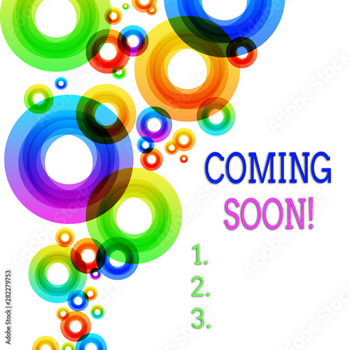 Word writing text Coming Soon. Business photo showcasing event or action that will happen after really short time Vibrant Multicolored Circles Disks of Different Sizes Overlapping Isolated