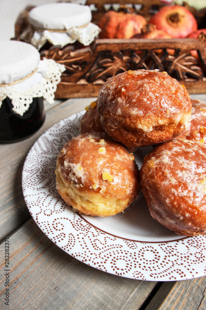 Stack of homemade donuts. Fat Thursday celebration - traditional polish donuts filled with marmalade.