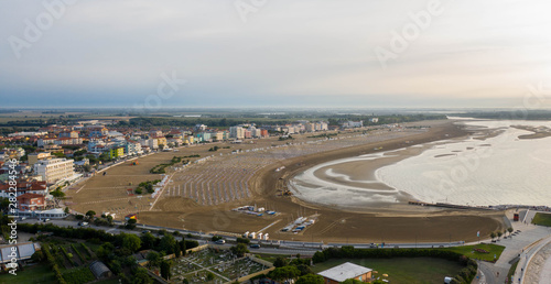 Spiaggia e mare di Caorle sui lidi con ombrelloni - panoramica dall'alto photo