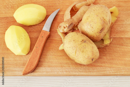 Peeling potatoes in a home kitchen.