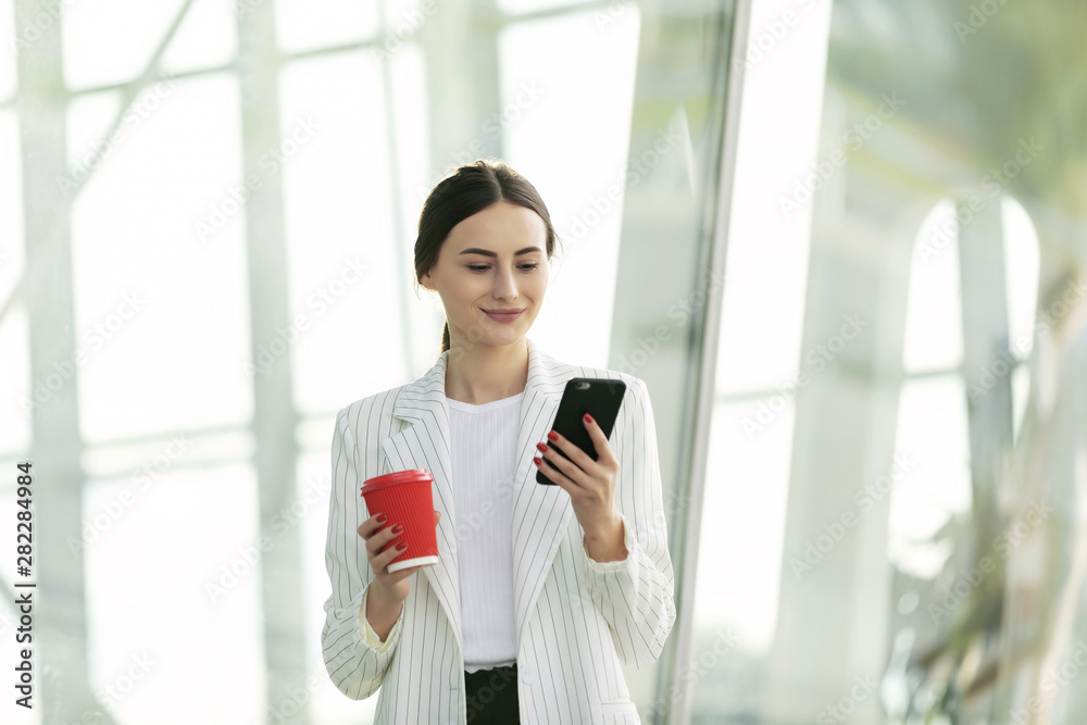 Business Woman Using Phone Near Office