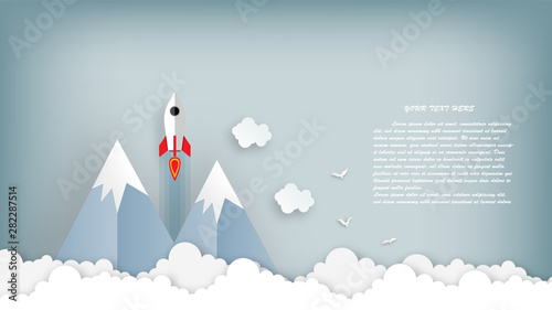 Paper art of rocket illustration flying over cloud. beautiful scenery with white clouds, vector art and illustration. © Go Ahead