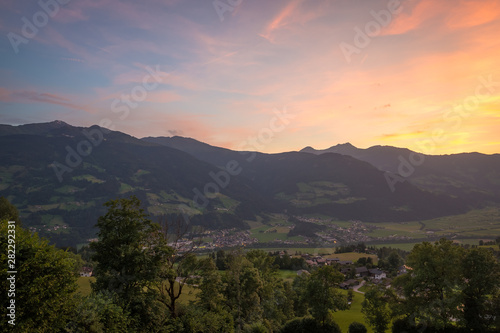 Colorful sunset over the valley Zillertal in Tirol, Austria © Menyhert