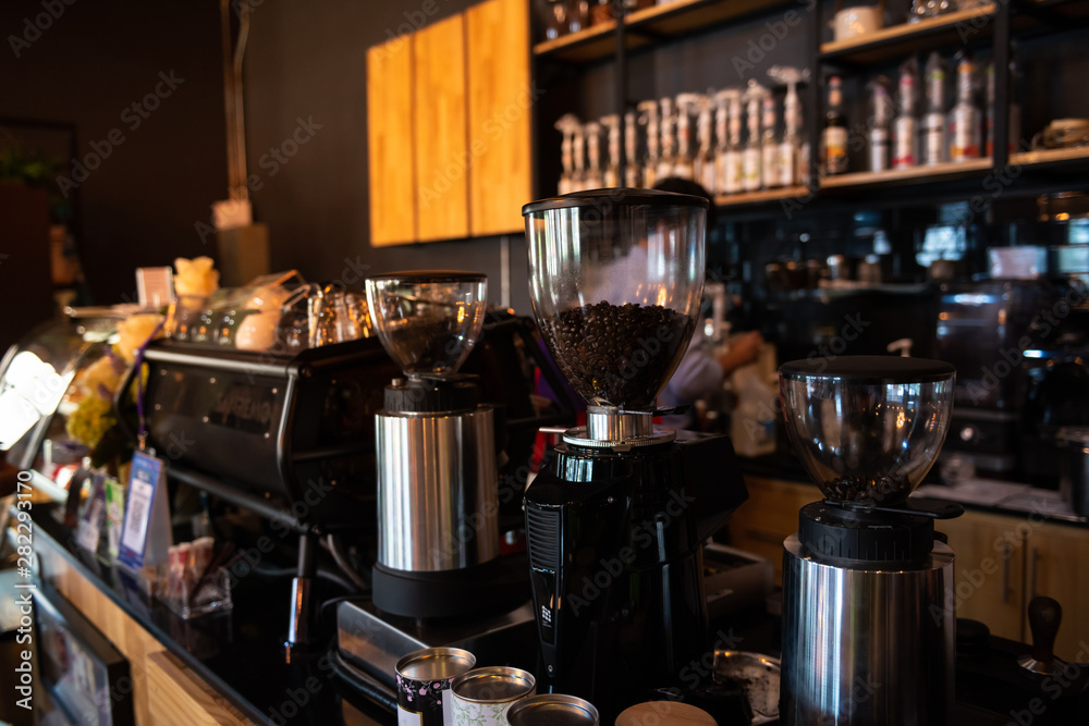 Coffee grinder and espresso coffee maker on counter in coffee shop Coffee grinder and espresso coffee maker on counter in coffee shop