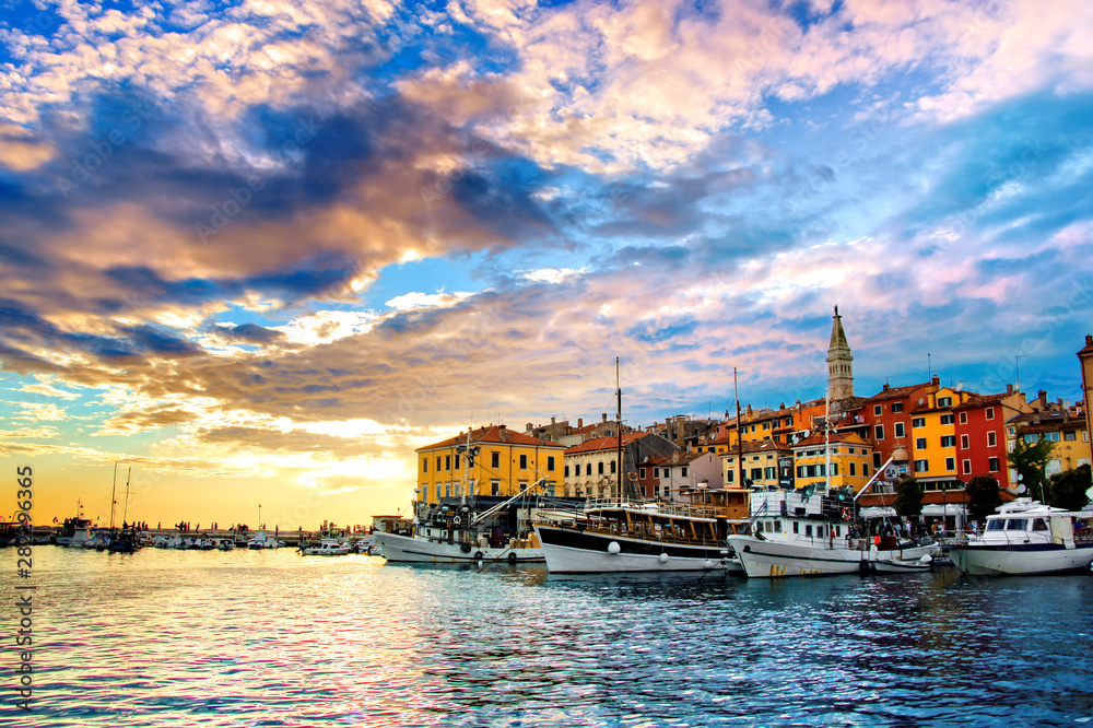 View of the old town and harbor of Rovinj, Croatia with vibrant sunset over the Adriatic sea