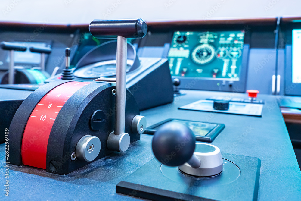 Ship throttles on the remote control ship. Modern ship control panel. The captains bridge. Ship throttles on the remote control ship. Modern ship control panel. The captains bridge.
