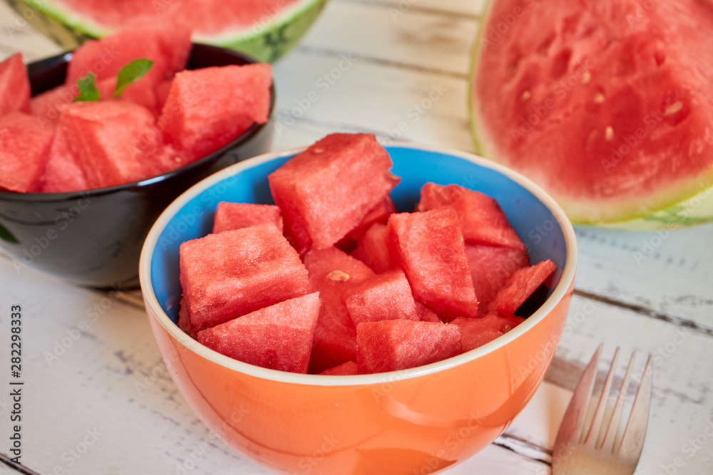 Two bowl with fresh watermelon on white table Two bowl with fresh watermelon on white table