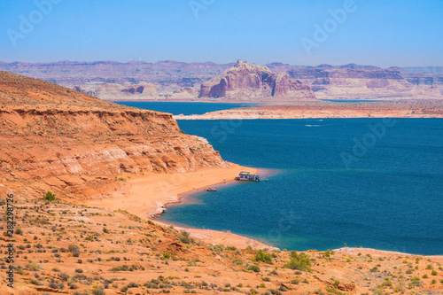 panorama red rock formations surrounding a blue lake in the desert of Arizona, United States