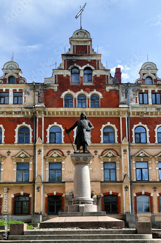 Vyborg, Russia -21.05.2019: View of the Old Town Hall Square and the monument to the founder of the city, Torgils Knutsson. photo