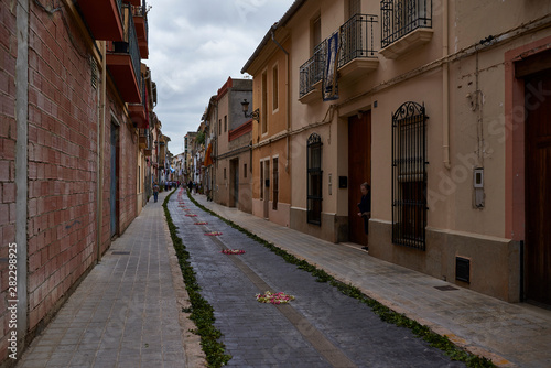 one of the charming streets decorated with flowers in Catadau, Spain