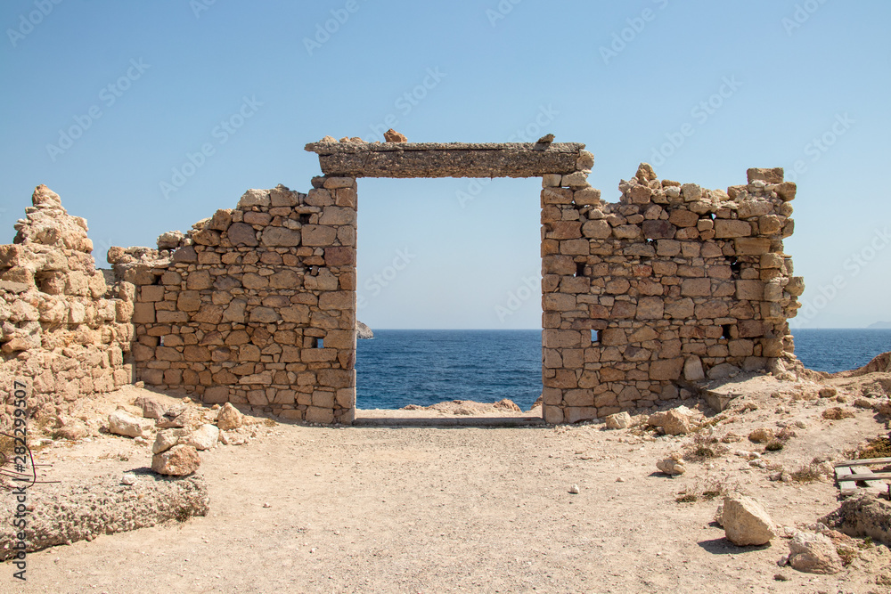 Stone gate overlook to sea, Milos island