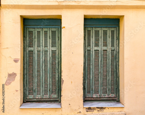 Windows with green wooden shutters