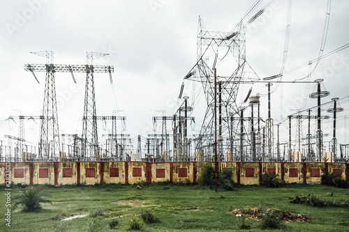 Photography Power plant with high voltage electric posts in the sideway of the road to Varanasi, India