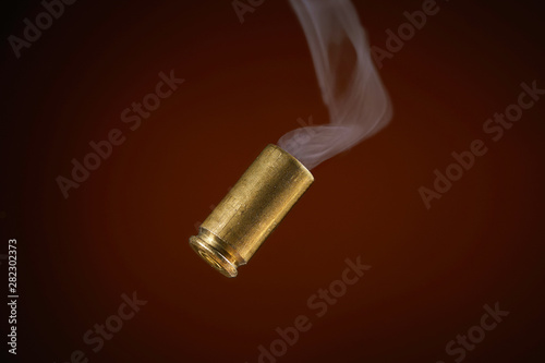 Obraz na plátně smoking bullet casing tumbling