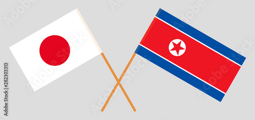Japan and North Korea. Crossed Japanese and Korean flags