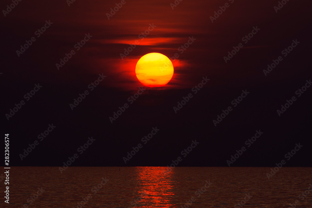 Red coloured Sun at Sunset on Koh Lanta, Thailand