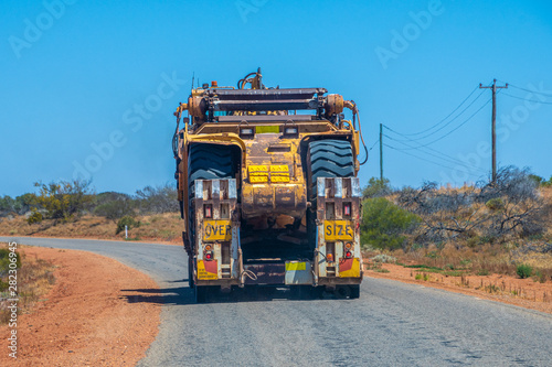 Road Train oversize load transport in Australia transporting big mining equipment