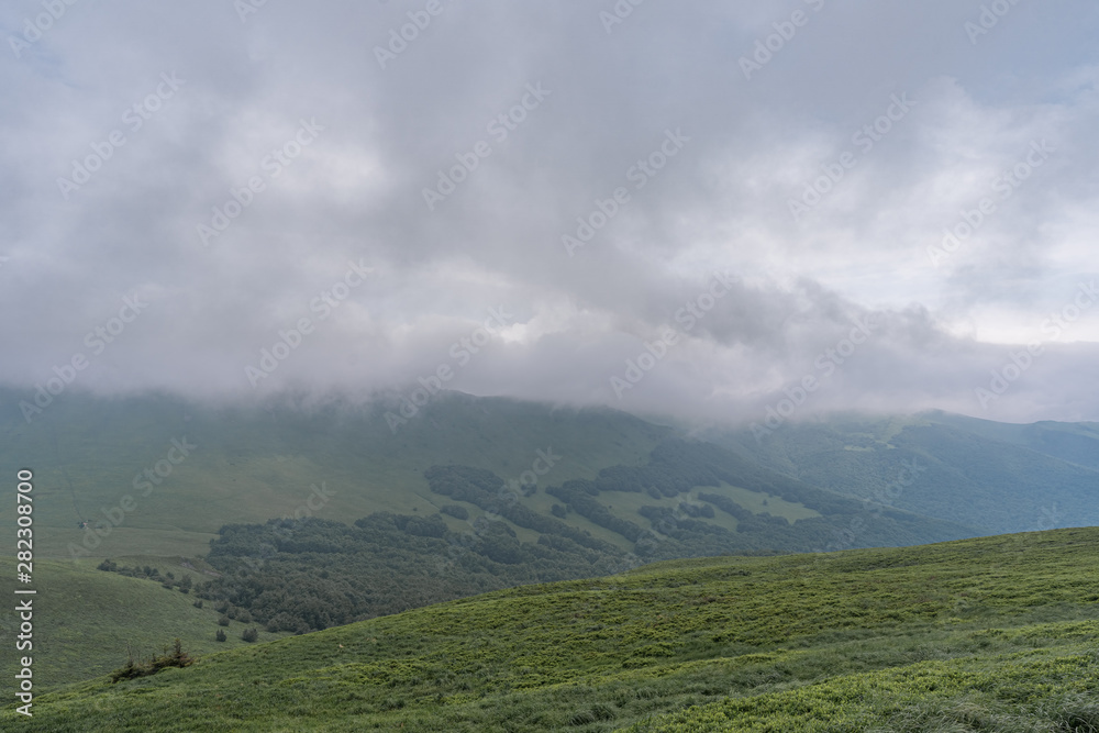 Mountain range in clouds in Bieszczady, Poland.