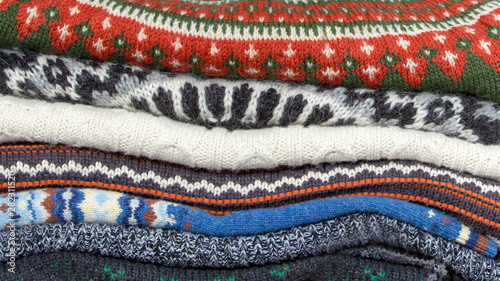 Stack of knitwear and cardigans background