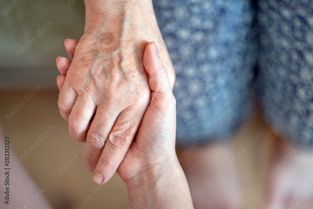 Caring for the older generation. Caring for the elderly. Family care. Hands of an elderly man in young hands. Caring for the older generation. Caring for the elderly. Family care. Hands of an elderly man in young hands.