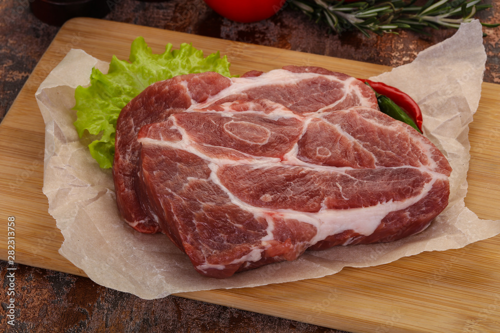 Raw pork neck steak