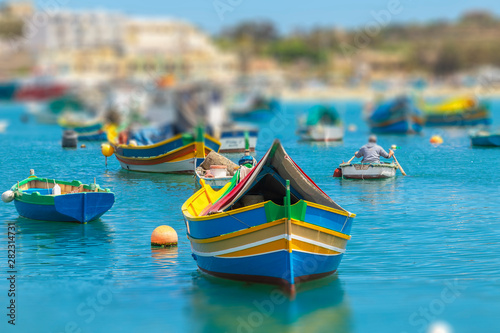 The traditional eyed boats in the harbor of fishing village Marsaxlokk in Malta