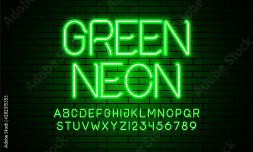 Green neon lamp alphabet font. Neon color shiny letters, numbers and symbols. Brick wall background. Stock vector typeface for any typography design.