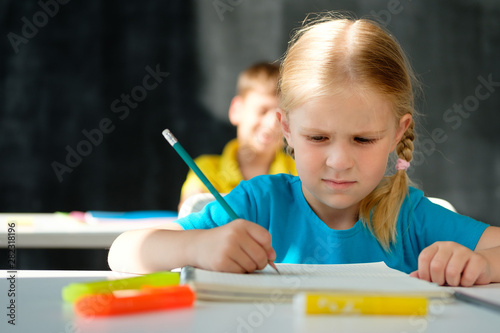 Dissatisfied little girl at school