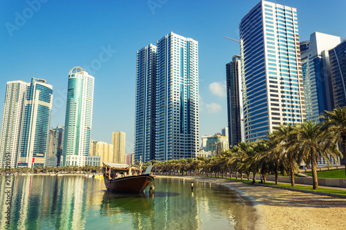 Boat on the beach near skyscrapers, Sharjah, United Arab Emirates © Tatiana Svetlichnaya