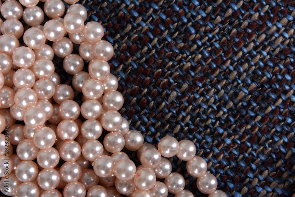 Pearl necklace on the gray background texture