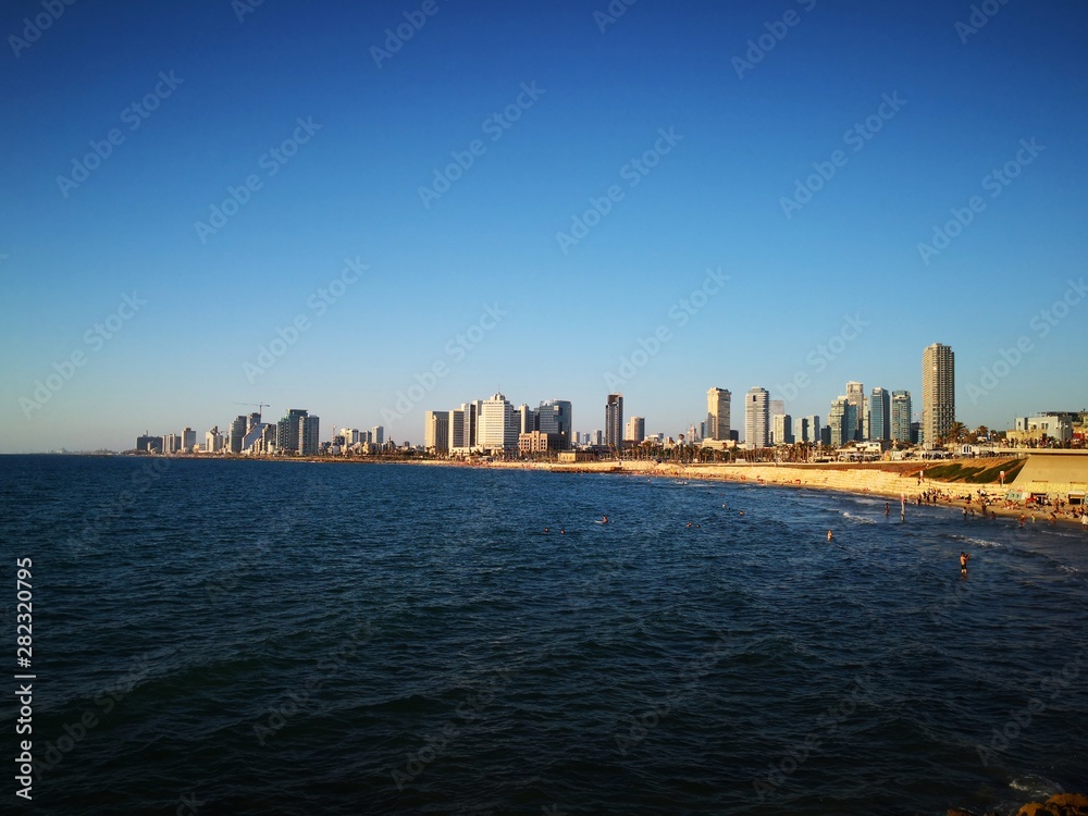 Tel Aviv skyline - Mediterranean sea and beaches. Sea coast and Tel Aviv buildings. Tel Aviv skyline - Mediterranean sea and beaches. Sea coast and Tel Aviv buildings.