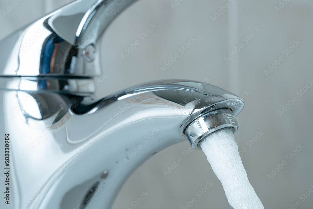 clean water flowing from the tap clean water flowing from the tap