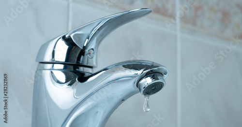 Tablou pe pânză water drop dripping from the tap and water shortage