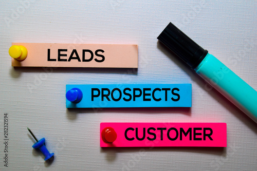 Leads, Prospects, Customer text on sticky notes isolated on office desk